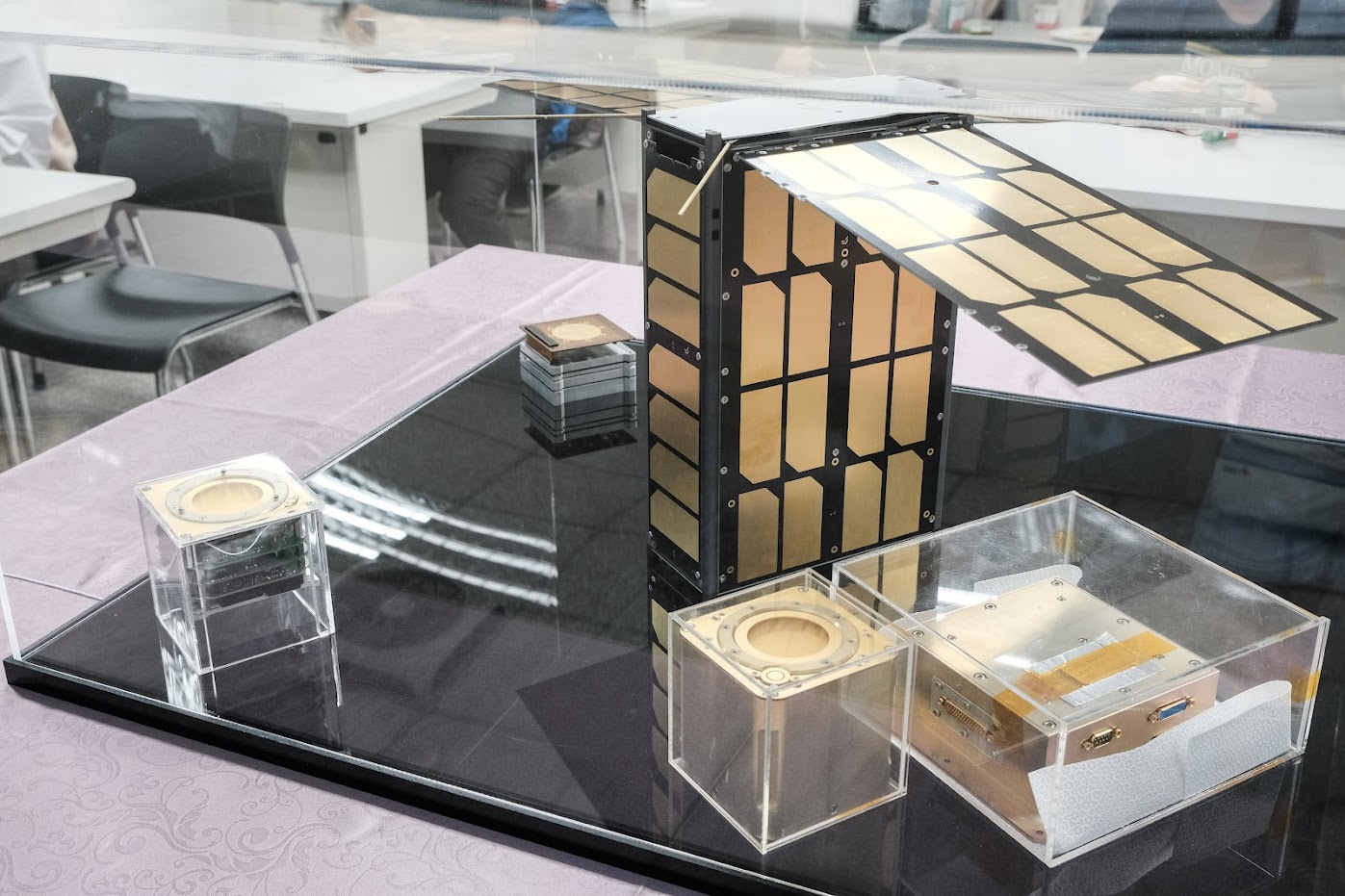 Models of CubeSat "PEARL" and the scientific payload of compact ionospheric probes (CIPs) were showcased. Photo by Huang Jun-Wei